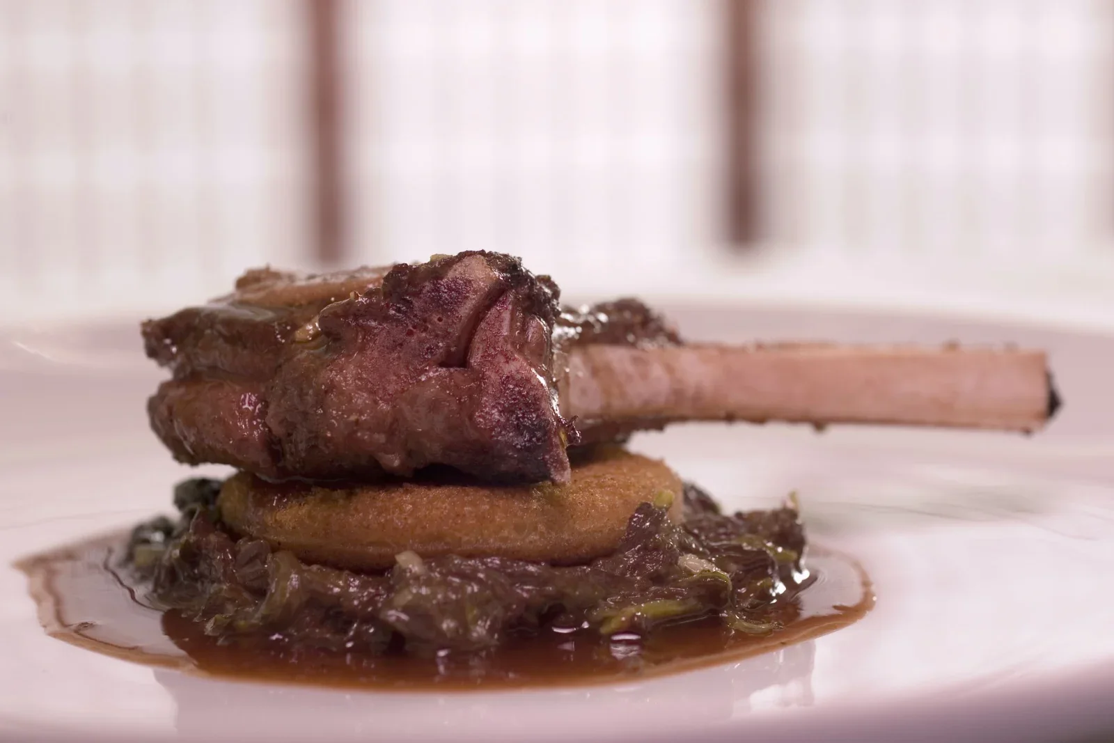 Oven-baked pork chops browned with herbs in a rustic baking dish